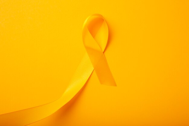 View of yellow ribbon on yellow background