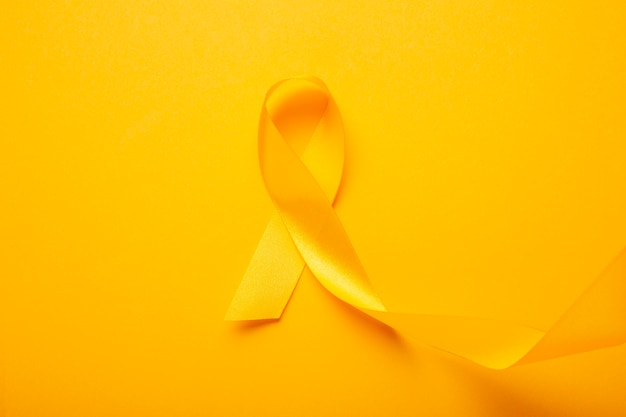 View of yellow ribbon on yellow background