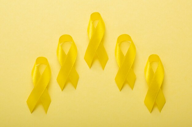 View of yellow ribbons on yellow background