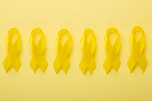 View of yellow ribbons on yellow background