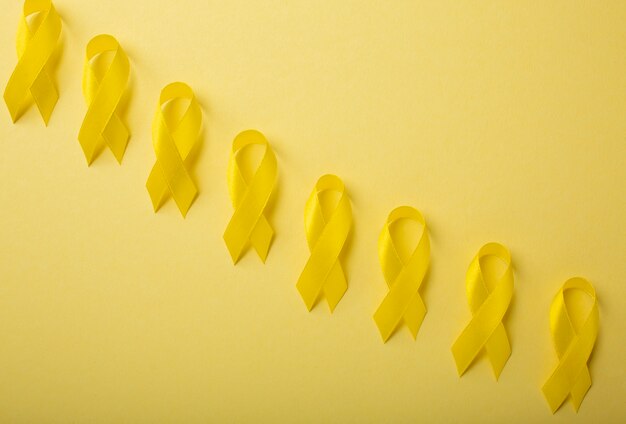 View of yellow ribbons on yellow background