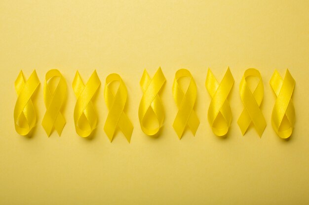 View of yellow ribbons on yellow background
