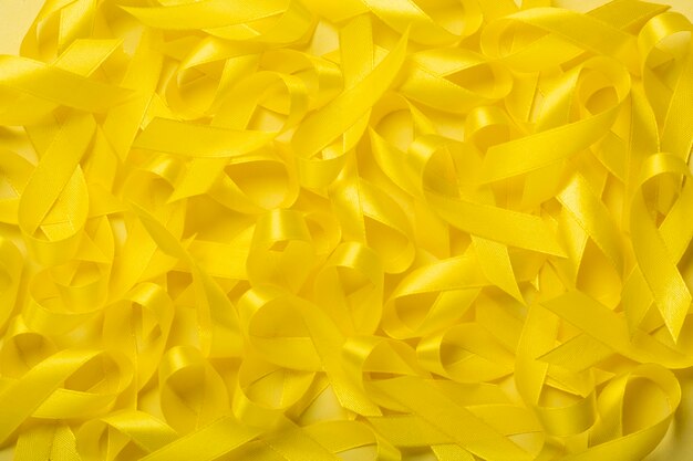 View of yellow ribbons on yellow background