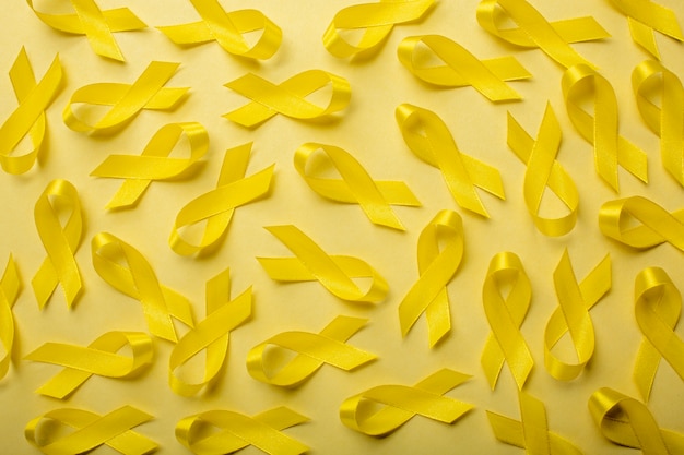 View of yellow ribbons on yellow background