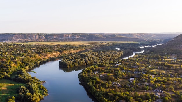 Village with orthodox church, river dividing into two parts