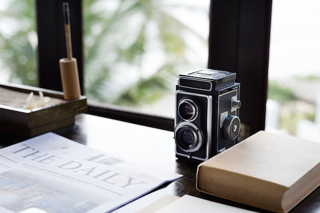 Free photo vintage analog camera on a desk