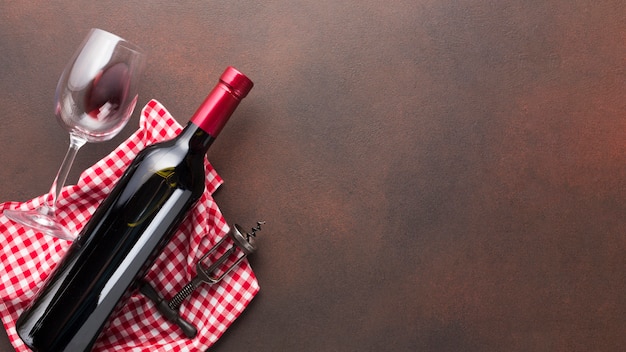 Vintage background with red bottle of wine