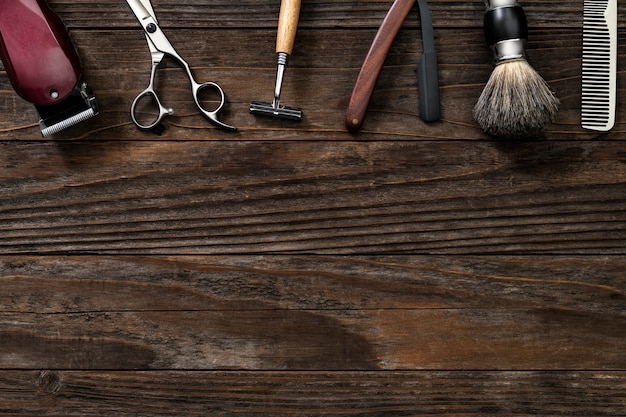 Vintage border salon tools on a wooden table in jobs and career concept