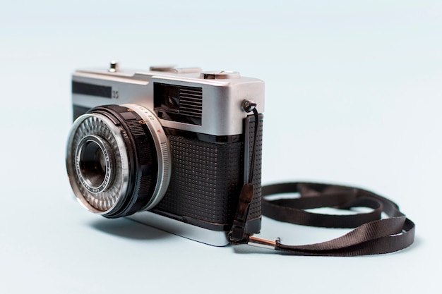 Vintage camera with lens isolated on white background