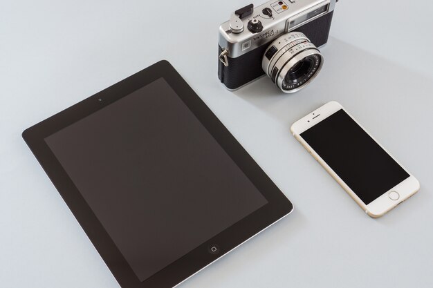 Vintage camera with tablet and mobile