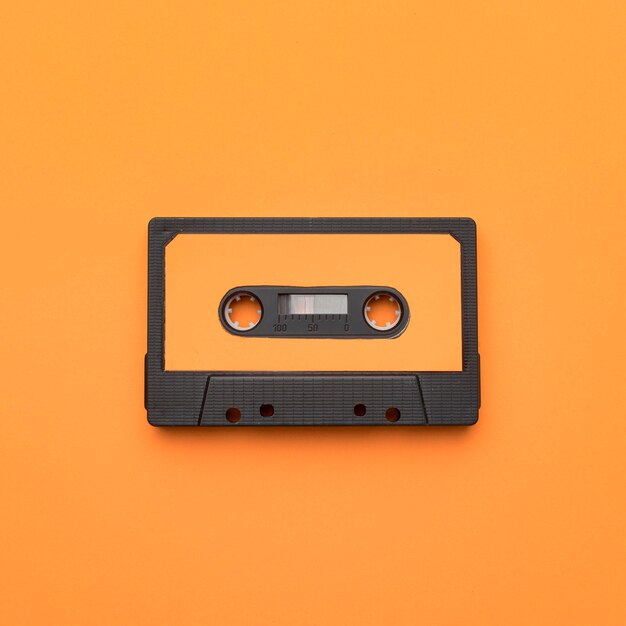 Vintage cassette tape on orange background