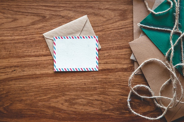 Vintage composition with envelopes on wooden background flat lay