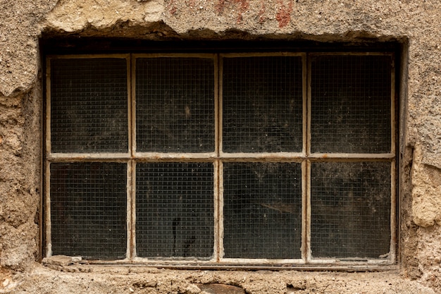 Free photo vintage dirty window with cement