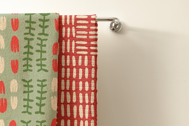 Free photo vintage ethnic pattern towels, green and red with design space