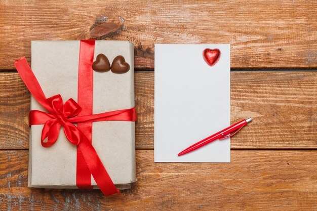 Vintage gift box with small hearts  on  wooden