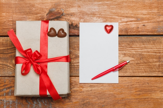 Vintage gift box with small hearts  on  wooden