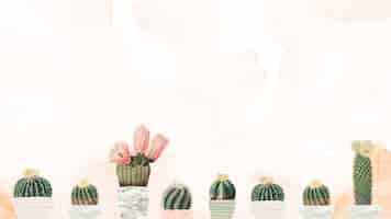 Free photo vintage green cactus with flower on stained paper background design element