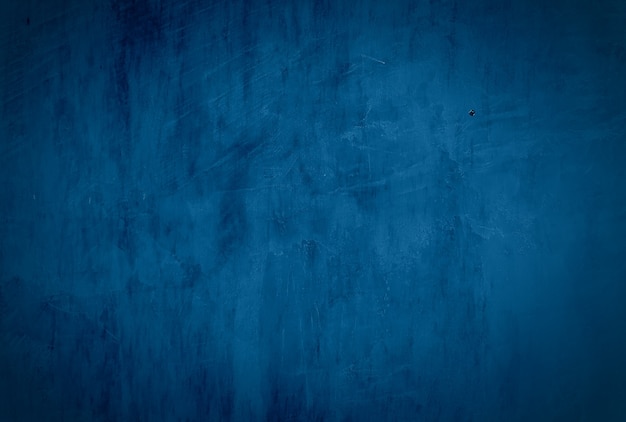 Урожай гранж синий бетонная текстура студия стены фон с виньеткой.