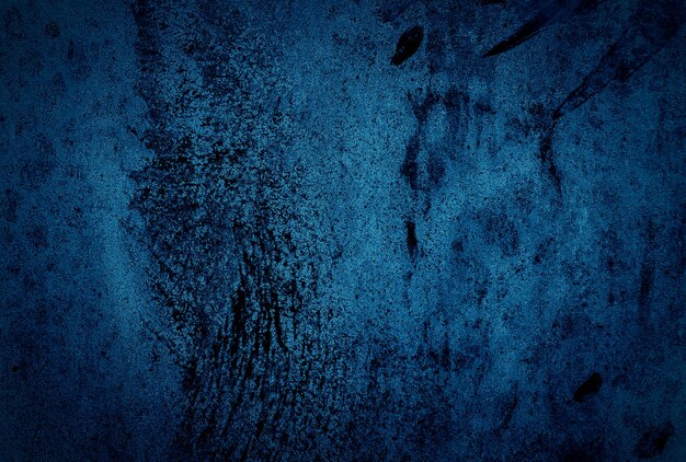 Vintage grunge blue concrete texture studio wall background with vignette.