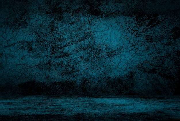 Vintage grunge blue concrete texture studio wall background with vignette.