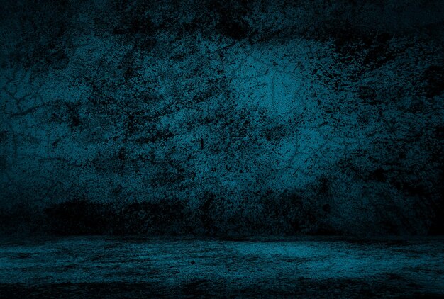 Vintage grunge blue concrete texture studio wall background with vignette.