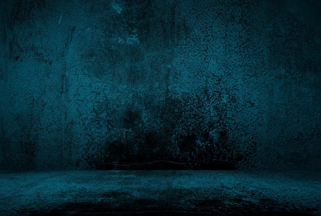 Free photo vintage grunge blue concrete texture studio wall background with vignette.