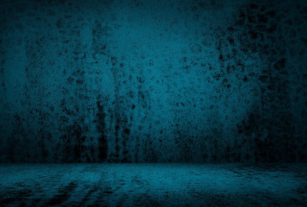 Vintage grunge blue concrete texture studio wall background with vignette.