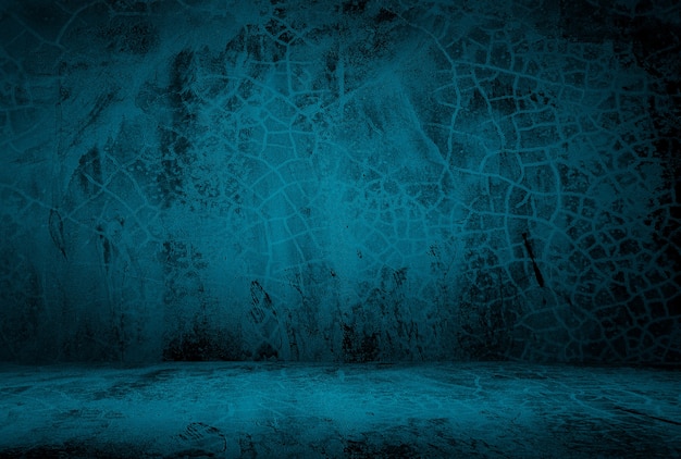 Free photo vintage grunge blue concrete texture studio wall background with vignette.