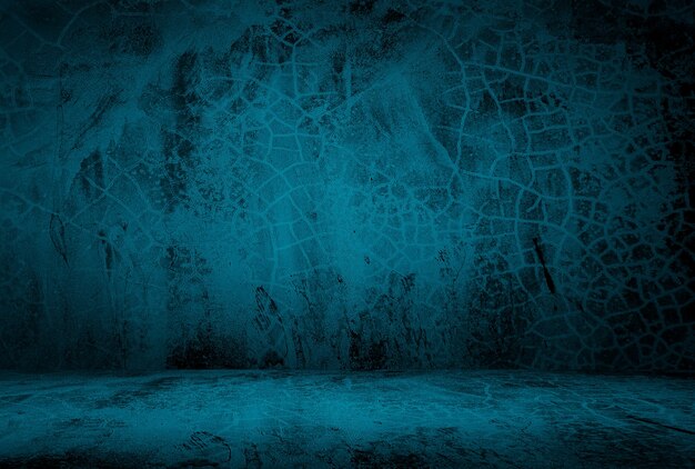 Vintage grunge blue concrete texture studio wall background with vignette.