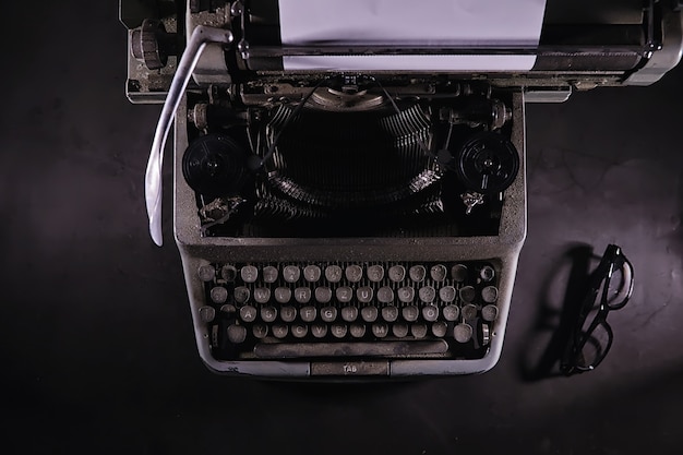 Vintage journalist tool. typewriter retro. the writer is at work. seal of the novel. journalist writer concept.