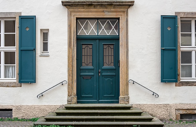 Vintage old doors and windows on the facade of the house