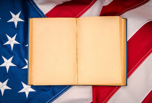 Vintage open book on American flag