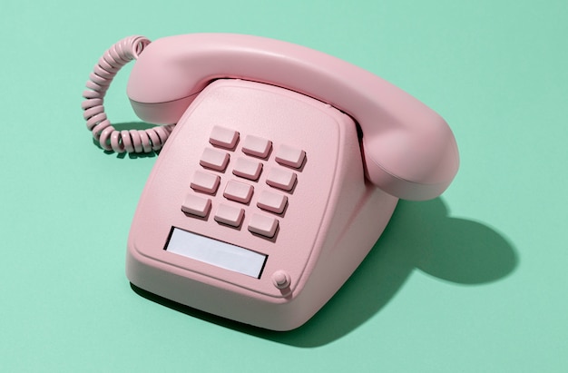 Free photo vintage pink telephone assortment