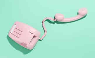 Free photo vintage pink telephone assortment