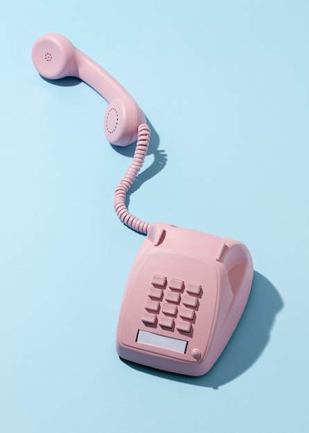 Free photo vintage pink telephone assortment