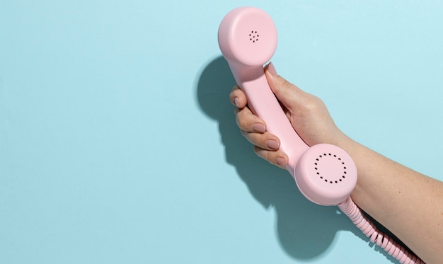 Vintage pink telephone composition