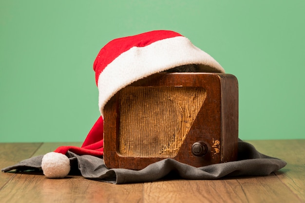 Vintage radio with santa claus hat