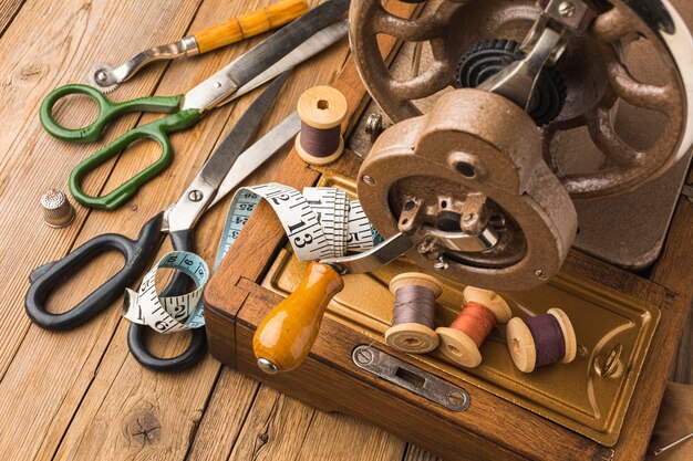 Vintage sewing machine with thread and measuring tape