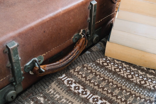 Free photo vintage suitcase and books