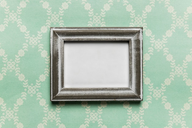 Free photo vintage white frame with pattern background