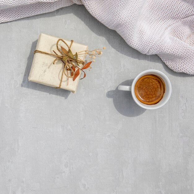 Vintage wrapped gift with a cup of coffee