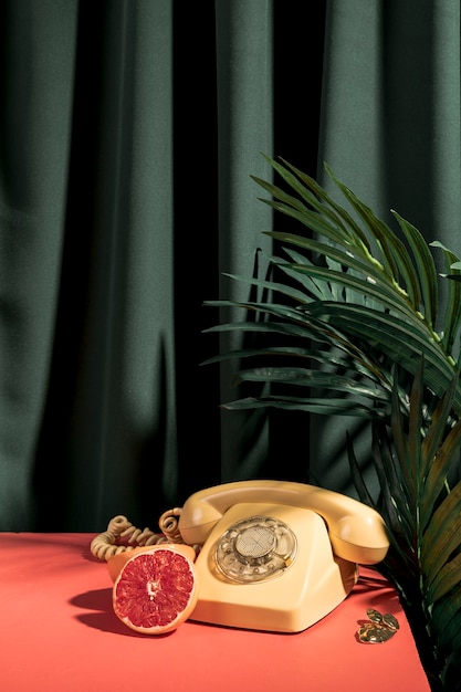 Vintage yellow telephone on table