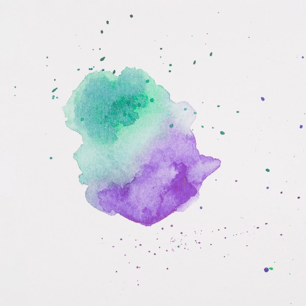 Violet and aquamarine blots of paints on white paper