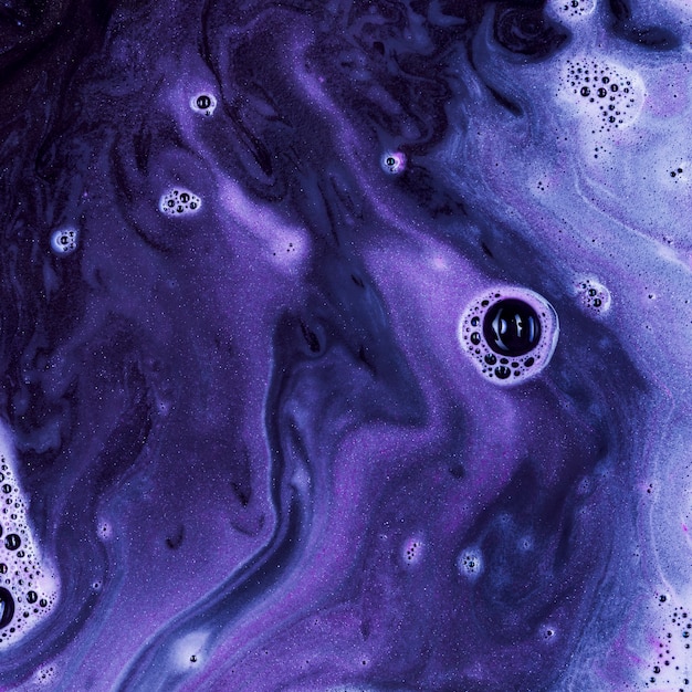 Violet liquid with light foam