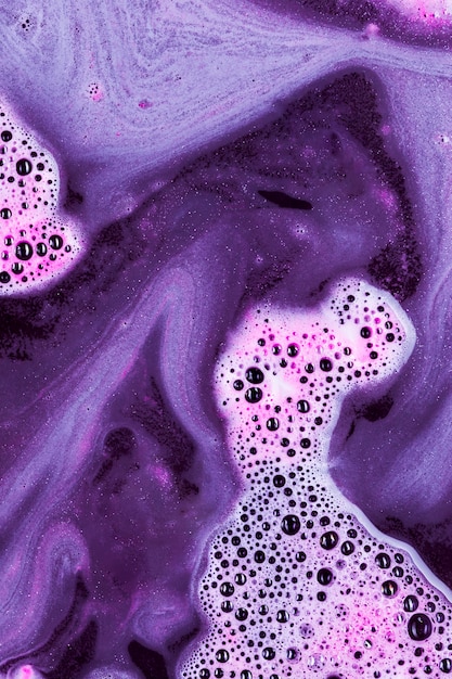 Free photo violet liquid with light pink foam and blobs