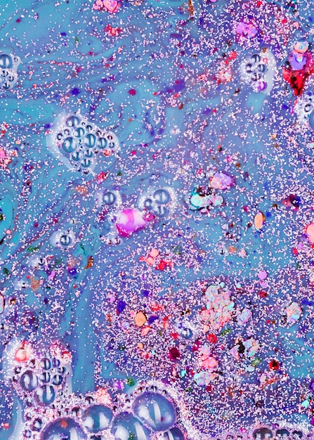 Violet liquid with pink crumbs