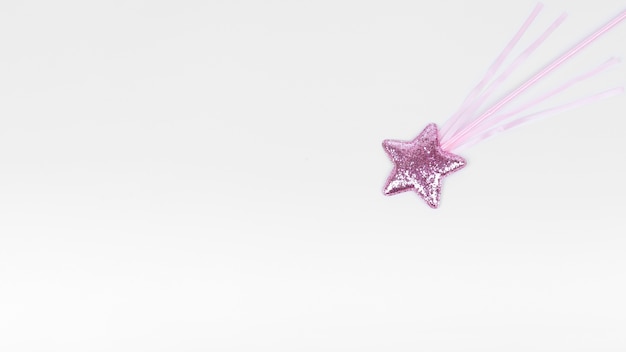 Violet star with stick on white copy space background