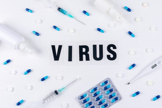 Free photo virus word with needles and pills