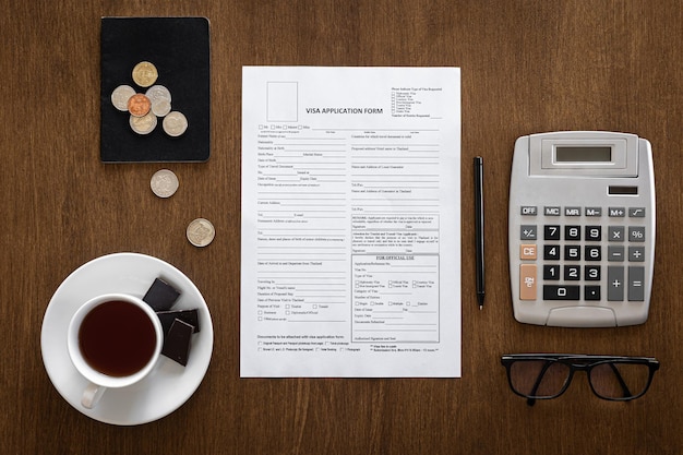 Visa application form on a wooden table visa processing registration flat lay