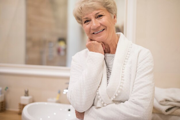 Vital senior woman in the bathroom